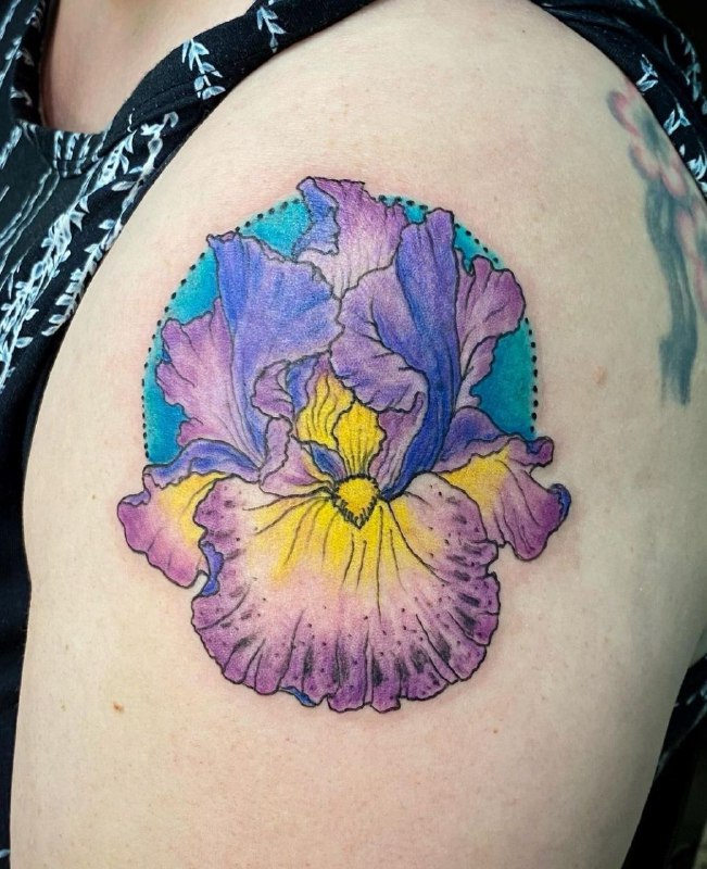 Color iris tattoo on the shoulder for men