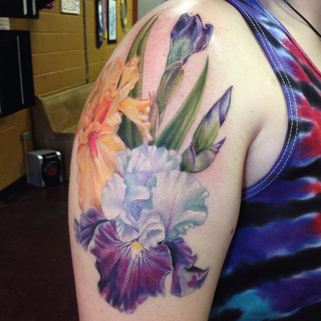 Color iris tattoo on the shoulder for men