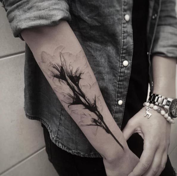 Iris tattoo on the forearm for men