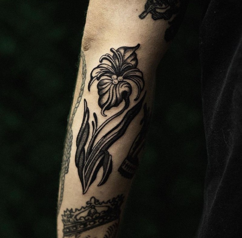 Iris tattoo on the arm for men