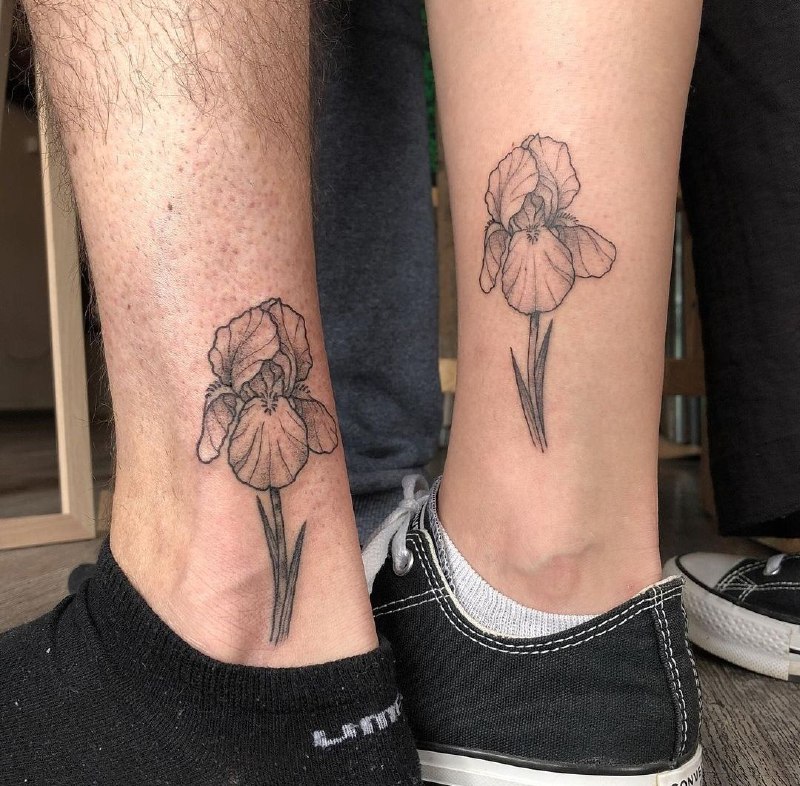 Iris tattoo on the shin for men