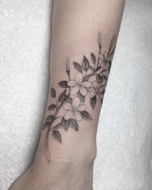 Jasmine tattoo on the forearm for women