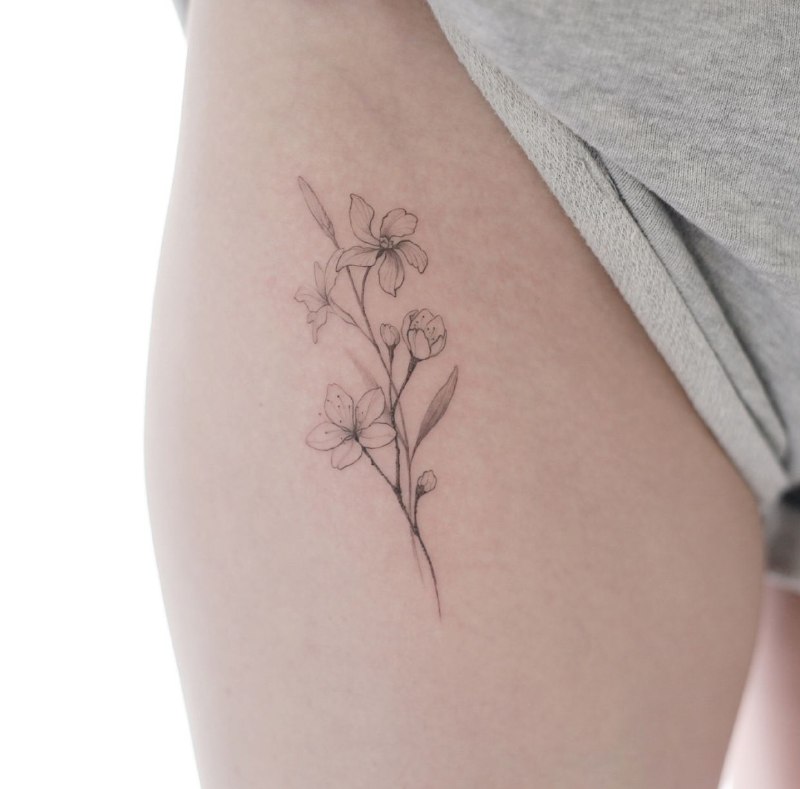 Jasmine tattoo on the hip for women