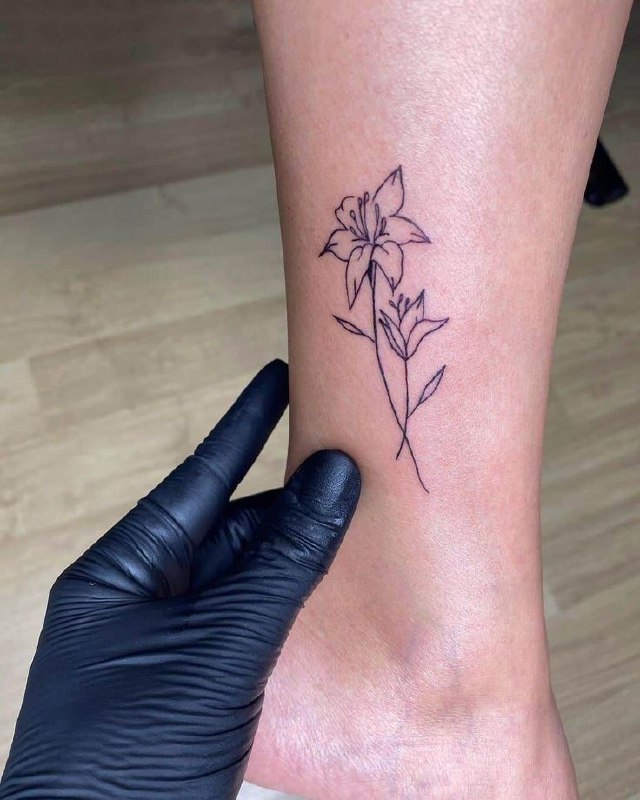 Jasmine tattoo on the shin for women