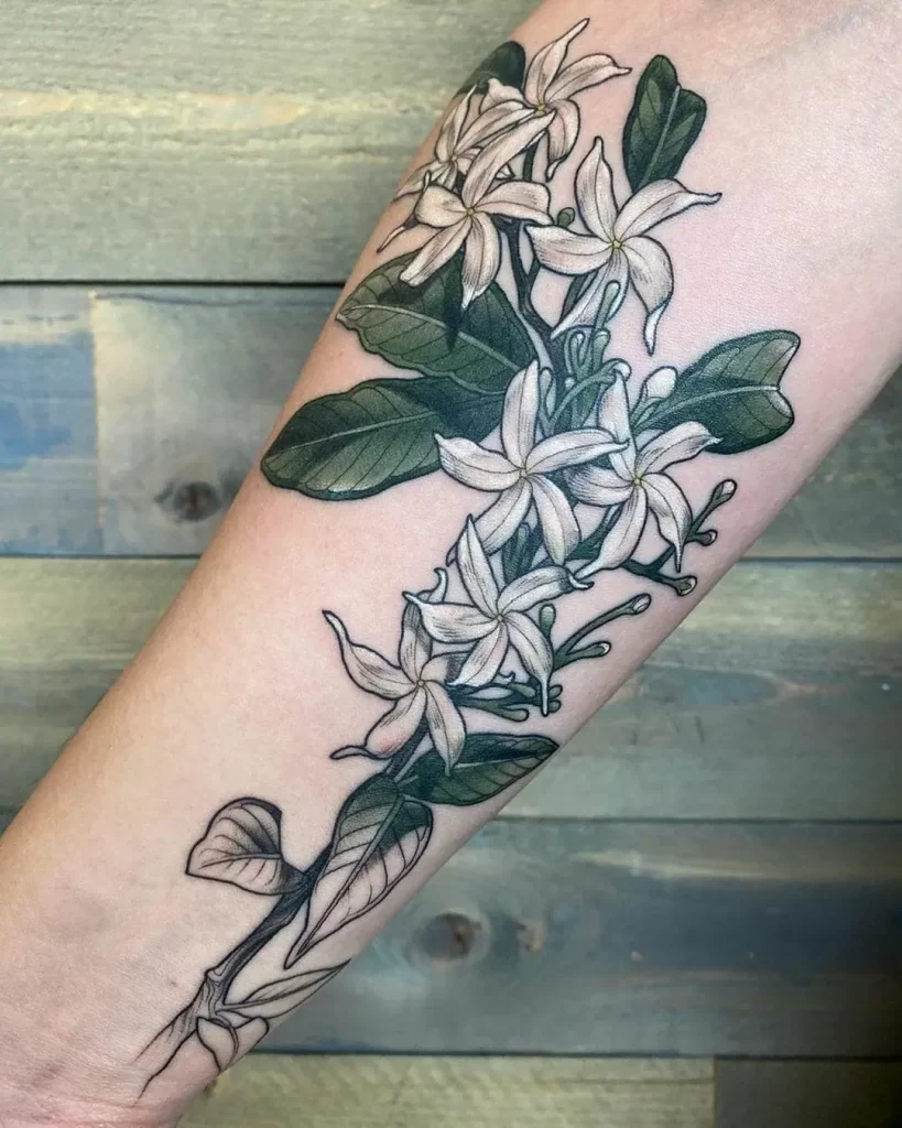 Colorful jasmine tattoo on the forearm for women