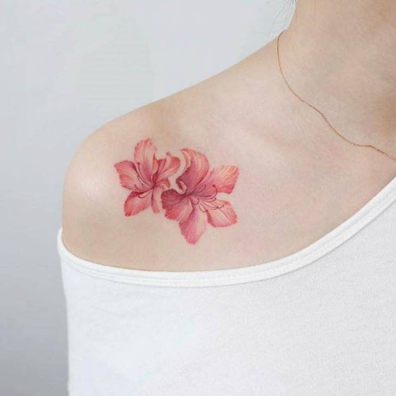 Color lily tattoo on the shoulder for women