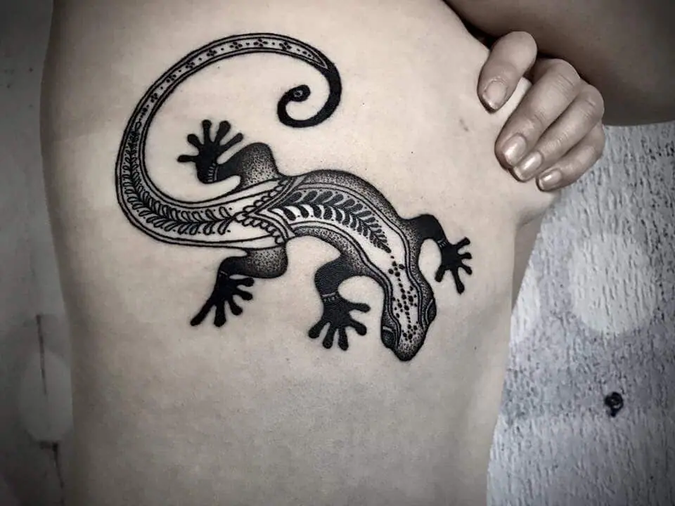 Lizard tattoo on the side for women