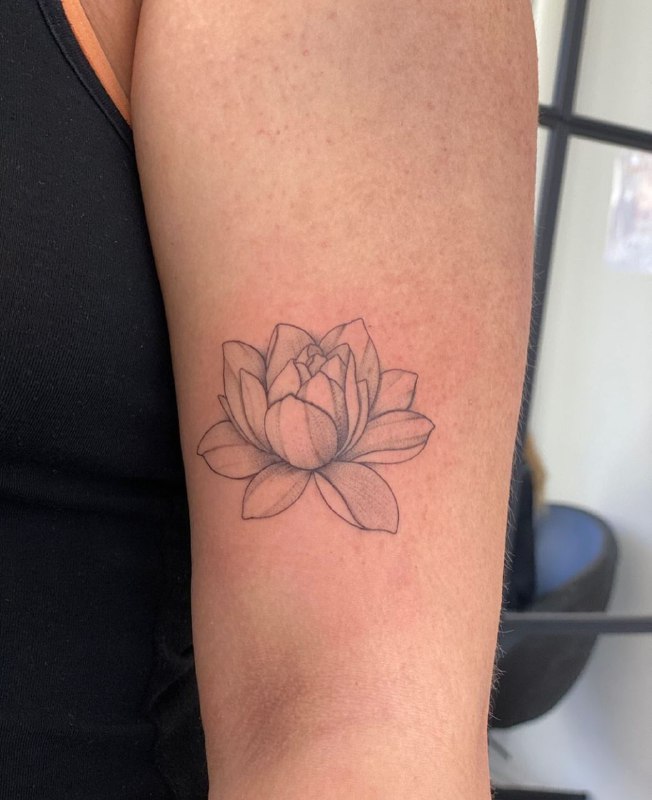 Lotus tattoo on the shoulder for women