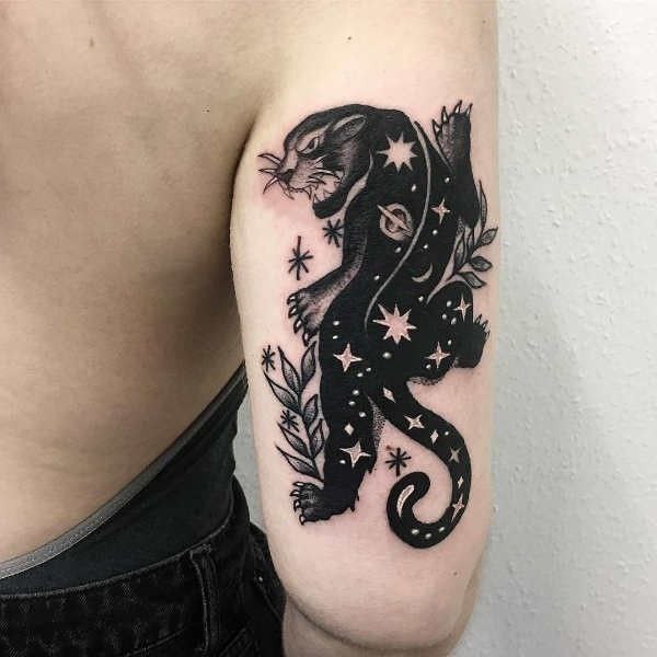 Tattoo of a panther on the shoulder for women