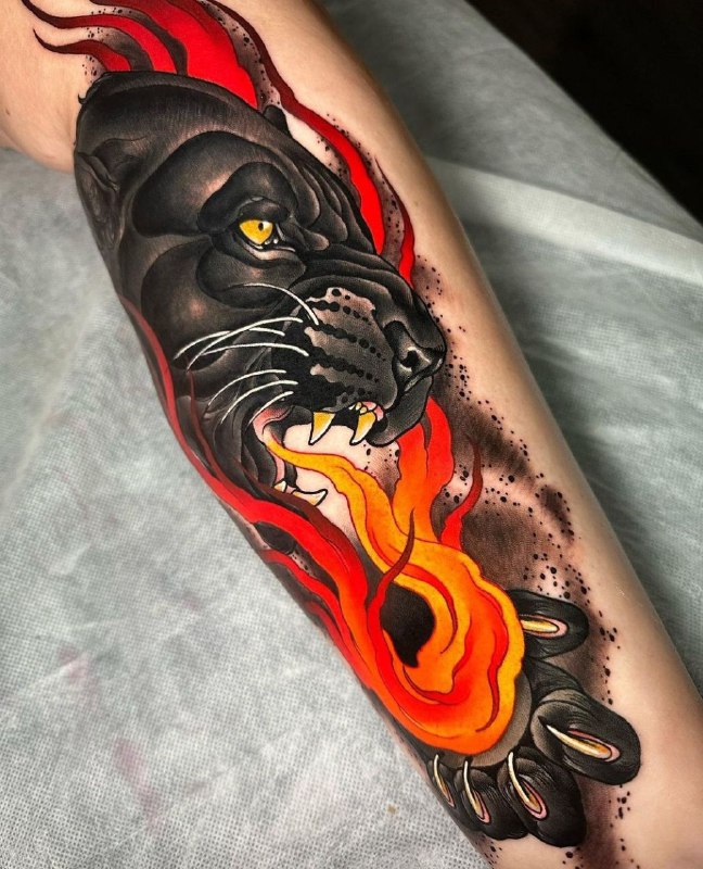 Colored panther tattoo on the shin for men