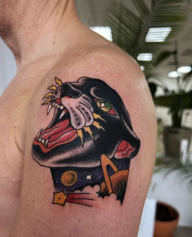 Colored panther tattoo on the shoulder for men