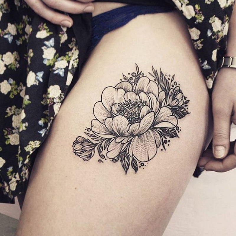 Large peony tattoo on the thigh for women