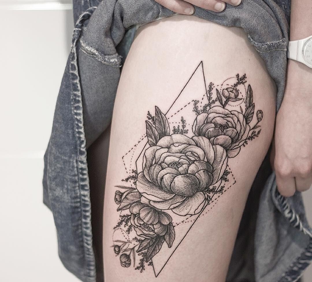 Large peony tattoo on the thigh for women