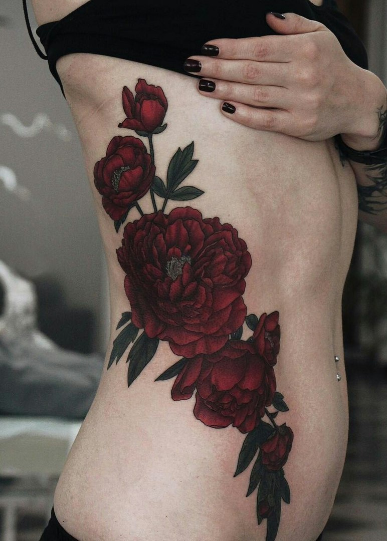 Color peony tattoo on the side for women