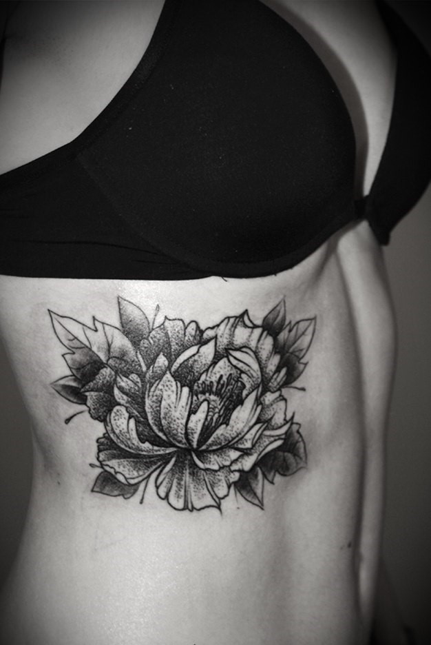 Large peony tattoo on the abdomen for women