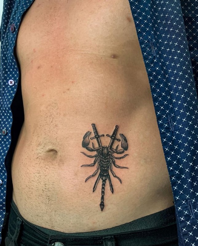 Tattoo of a scorpion on the stomach for men