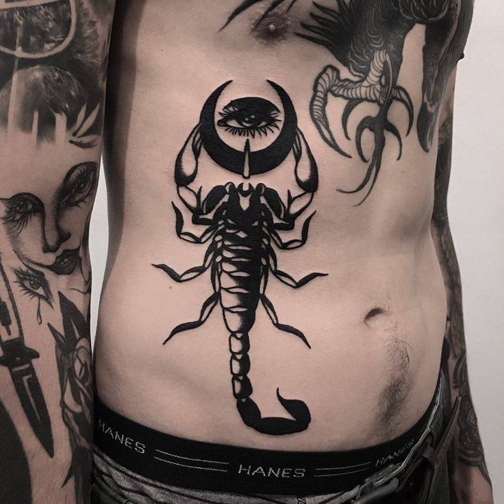 Tattoo of a scorpion on the stomach for men