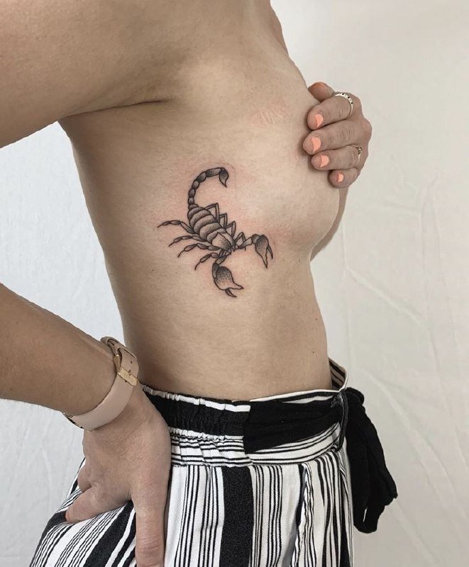 Scorpion tattoo on the side for women