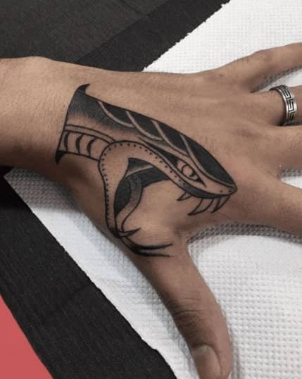 Snake tattoo on the hand for men