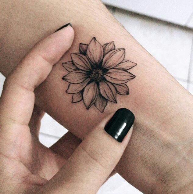 Sunflower tattoo on the arm for women