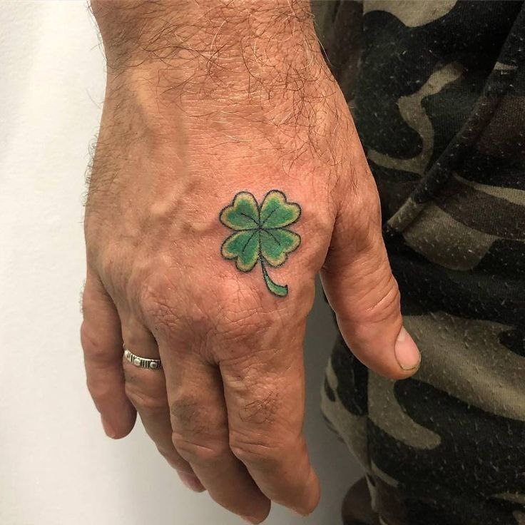 Colored clover tattoo on the brush for men