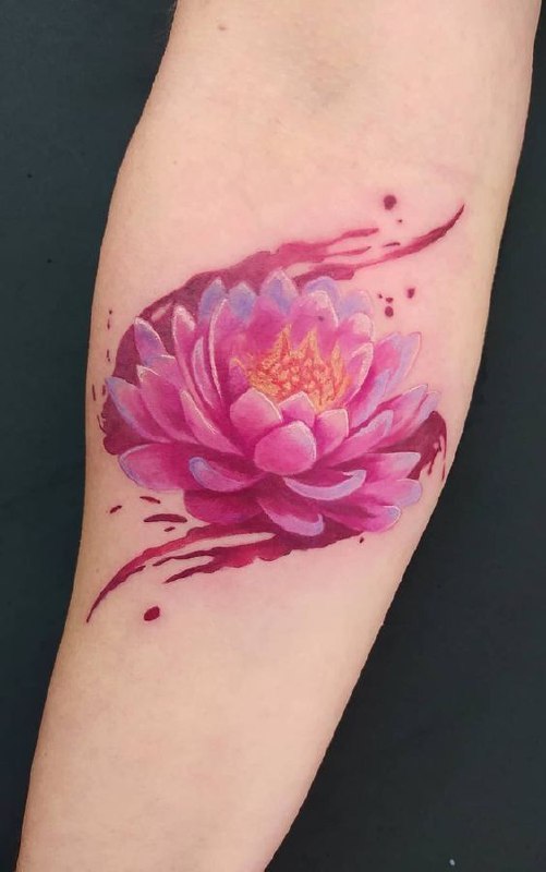 Colored lotus tattoo on the forearm for women