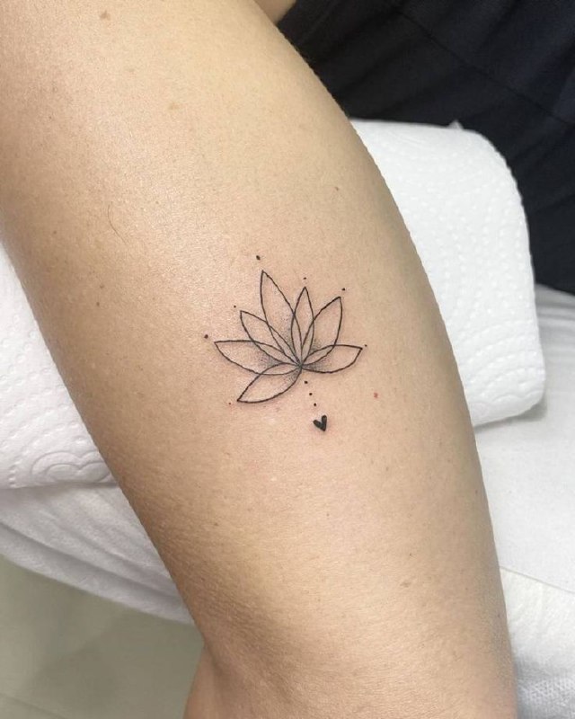 Lotus and heart tattoo on the shin for women