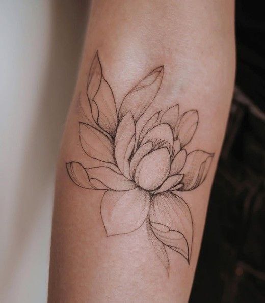 Large lotus tattoo on the forearm for women