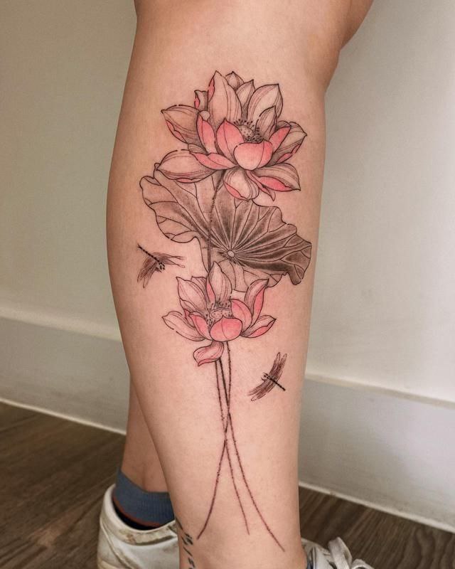 Large lotus tattoo on the shin for women