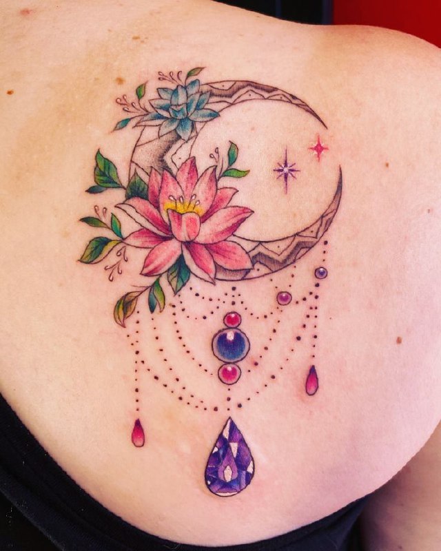 Colored lotus and month tattoo on the shoulder blade for women