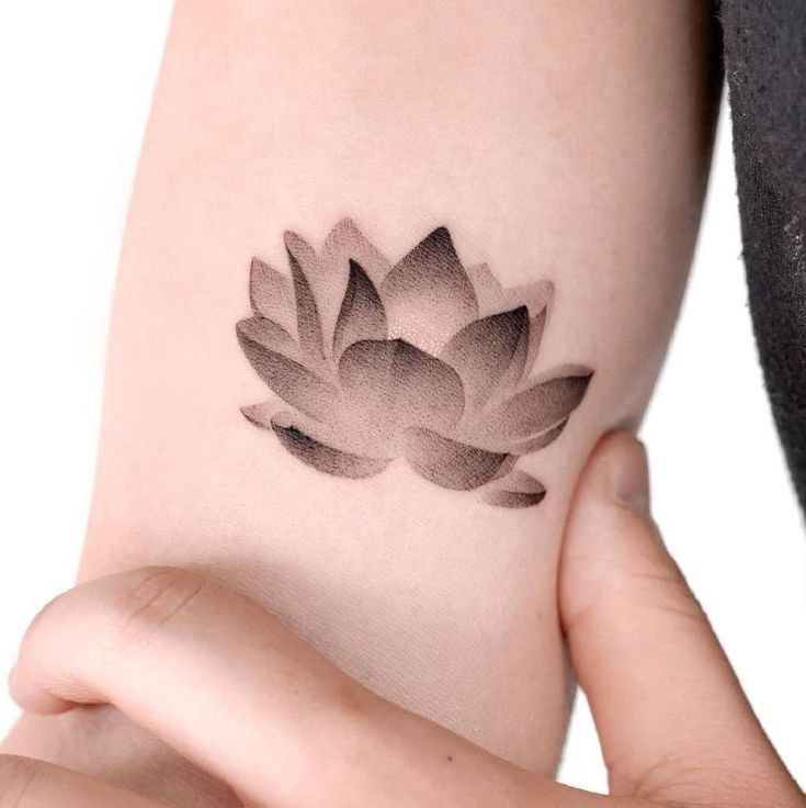 Lotus tattoo on forearm for women