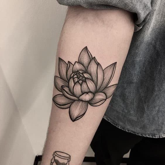 Large lotus tattoo on the forearm for men