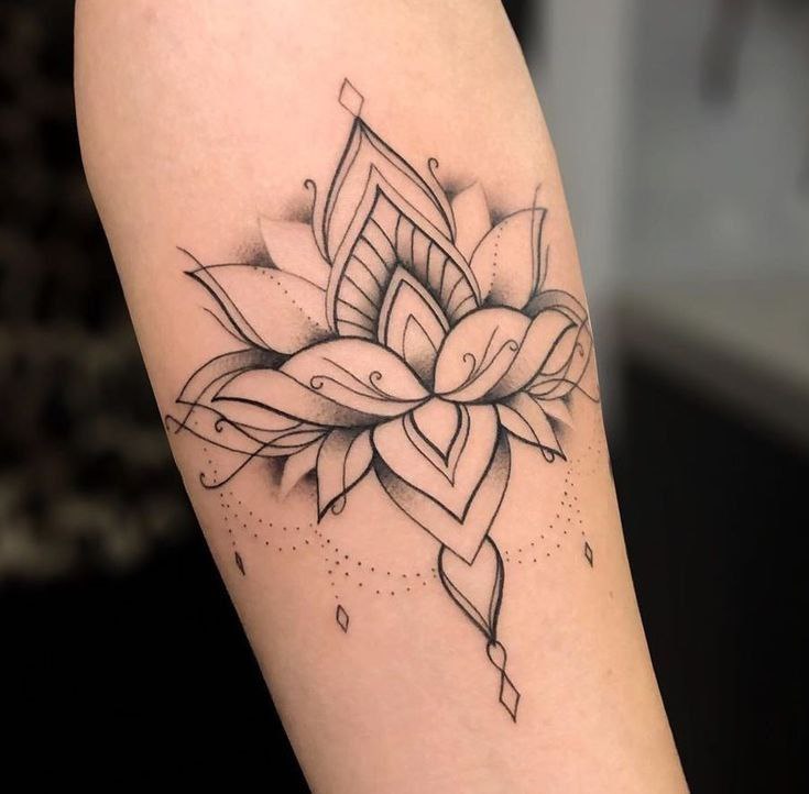 Lotus tattoo on the forearm for men