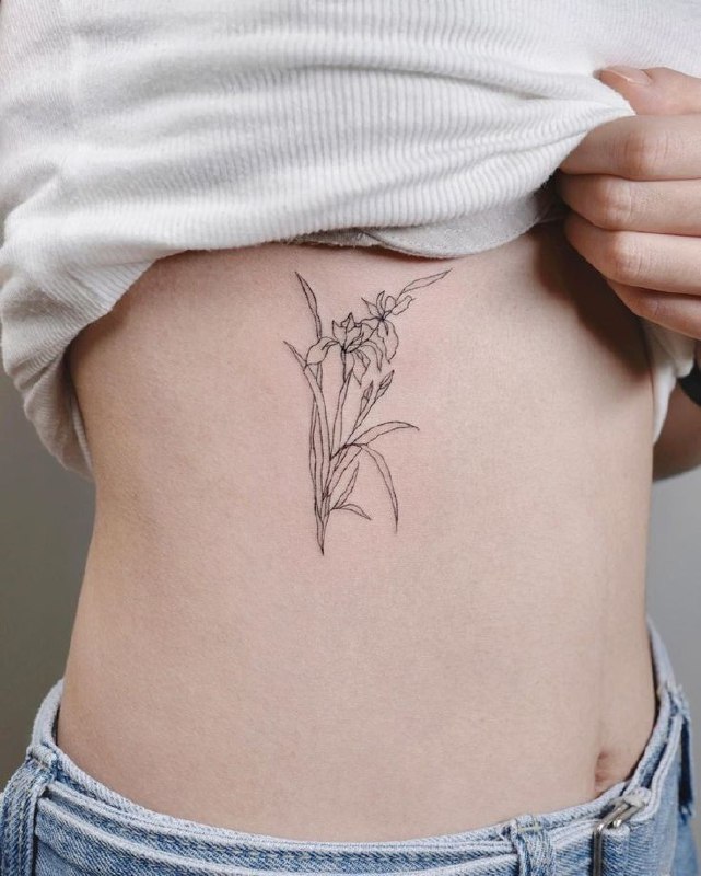 Iris tattoo on the side for women