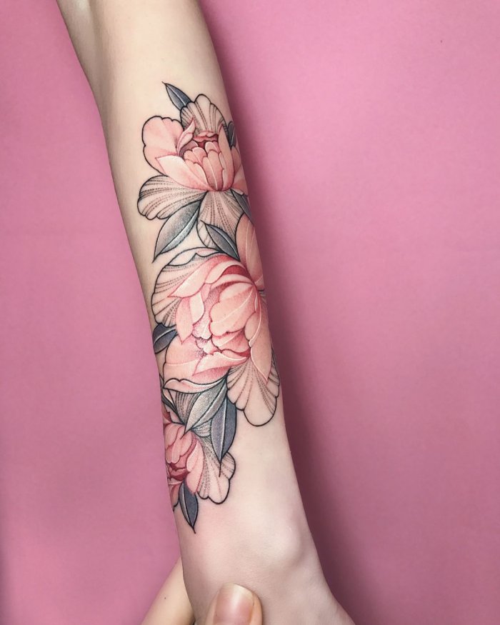 Color tattoo on the forearm for women