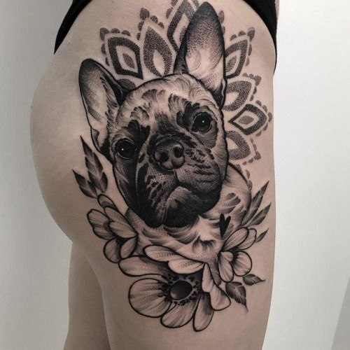 Tattoo of a dog on the hip for women