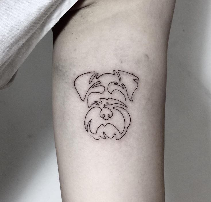 Tattoo of a dog on the shoulder for women