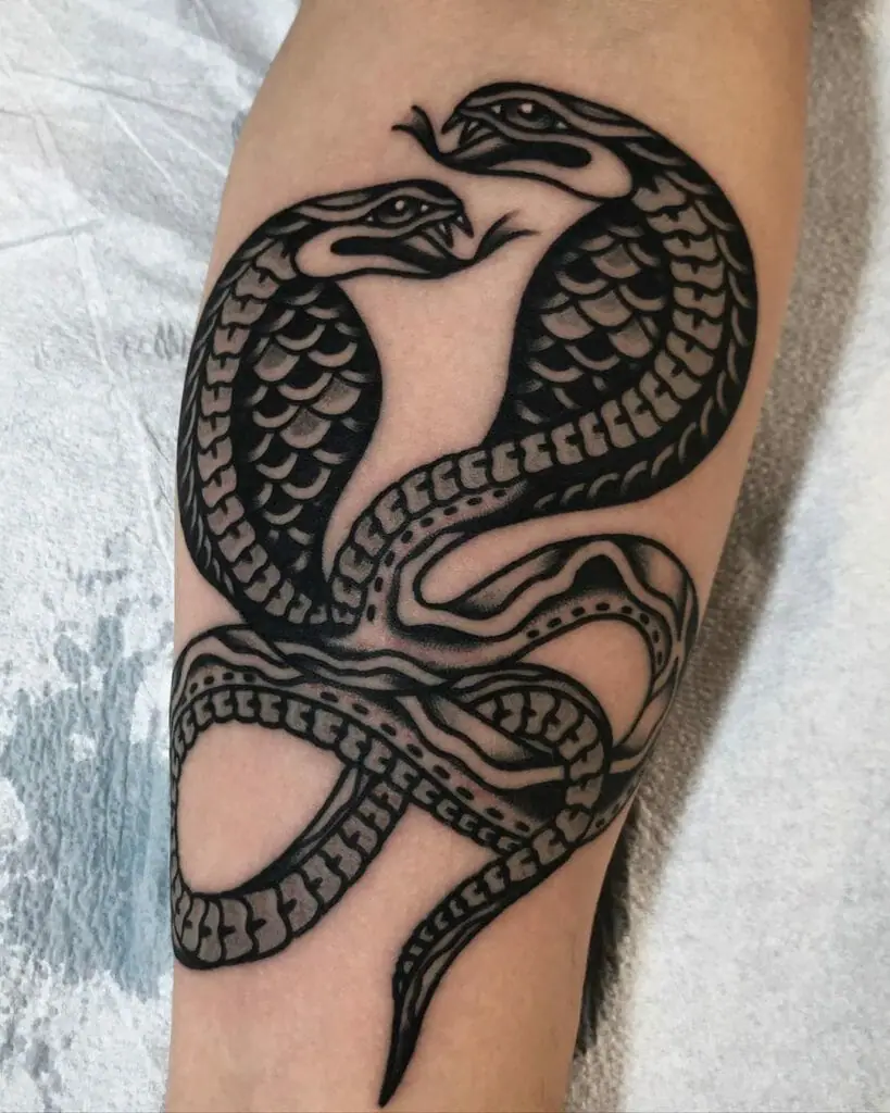 Cobra tattoo on the forearm for women