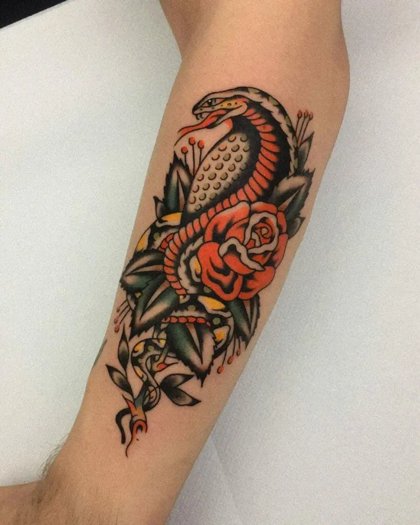 Tattoo of a colored cobra on the arm for men