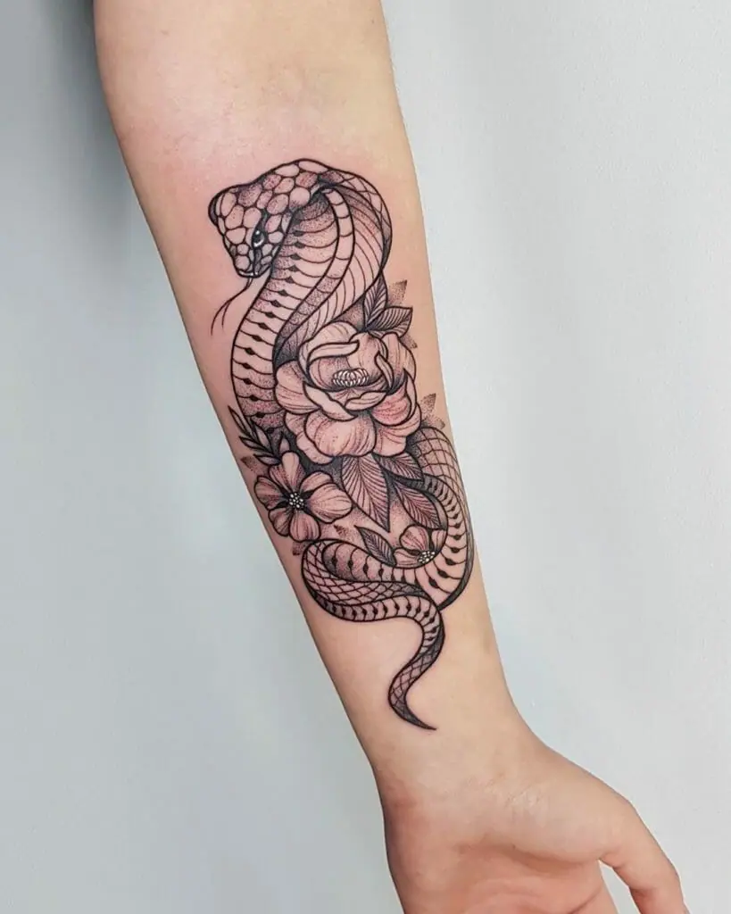 Cobra tattoo on the forearm for women