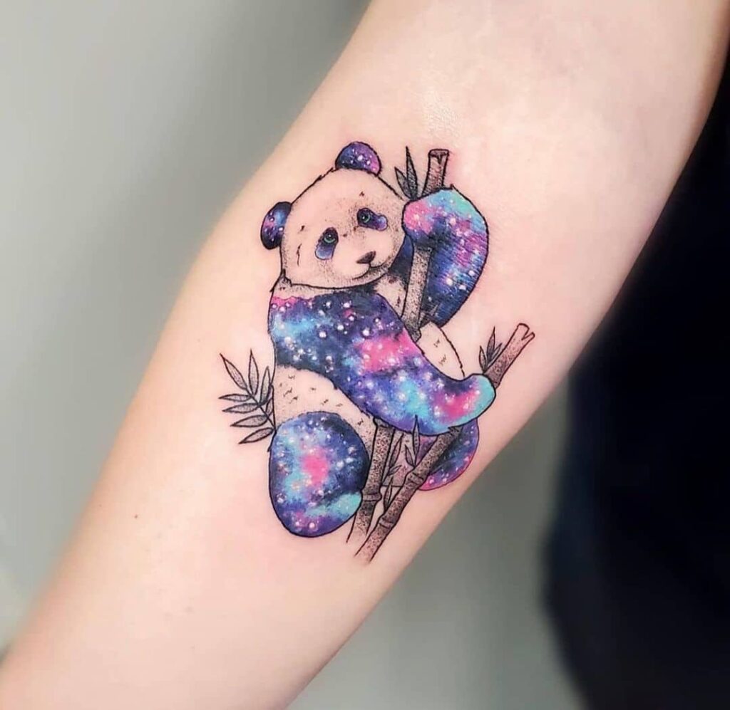 Colored panda tattoo on the forearm for women