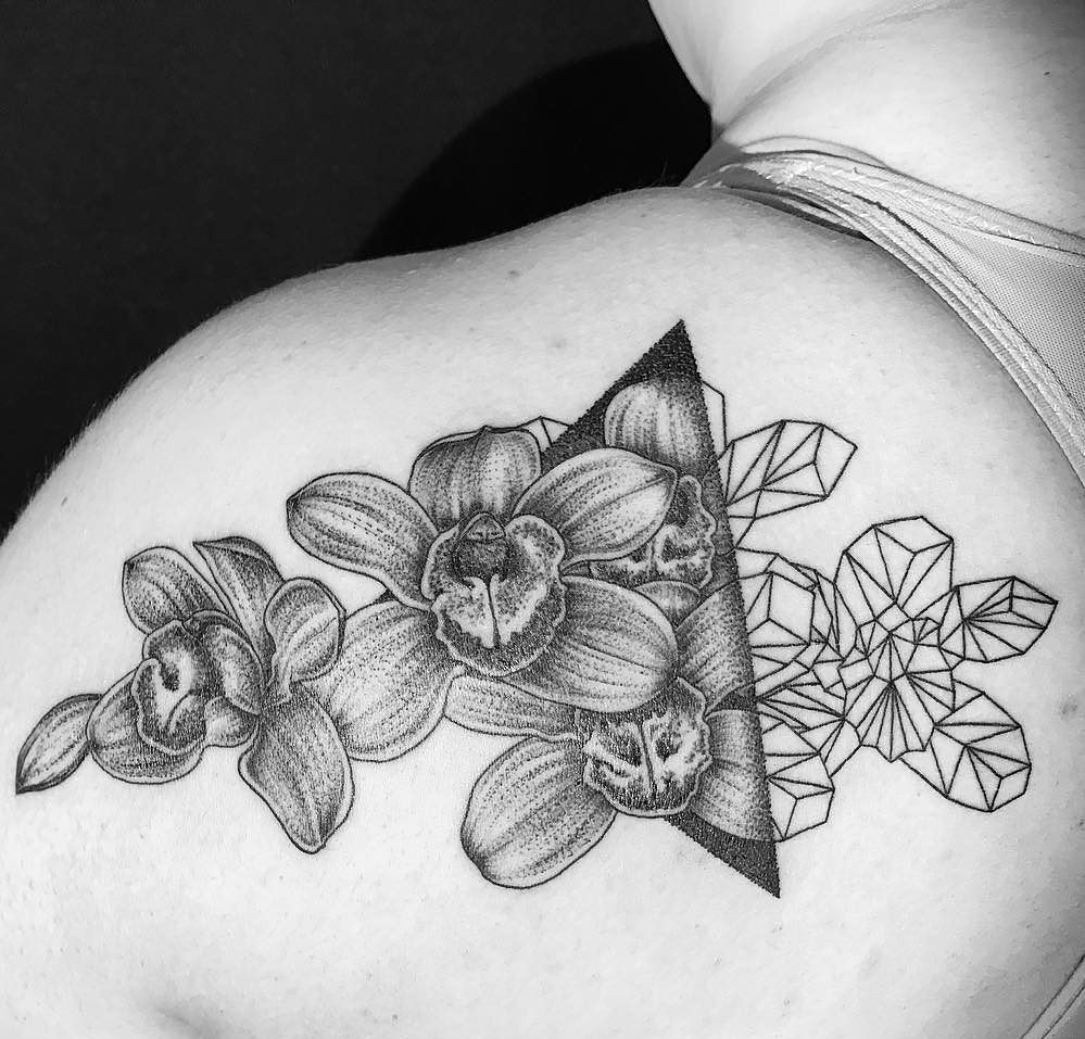 Orchid tattoo on the shoulder blade for women Orchid tattoo on the shoulder blade for women