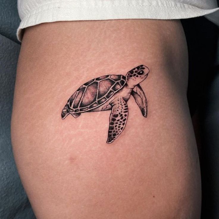 Turtle tattoo on the leg for women