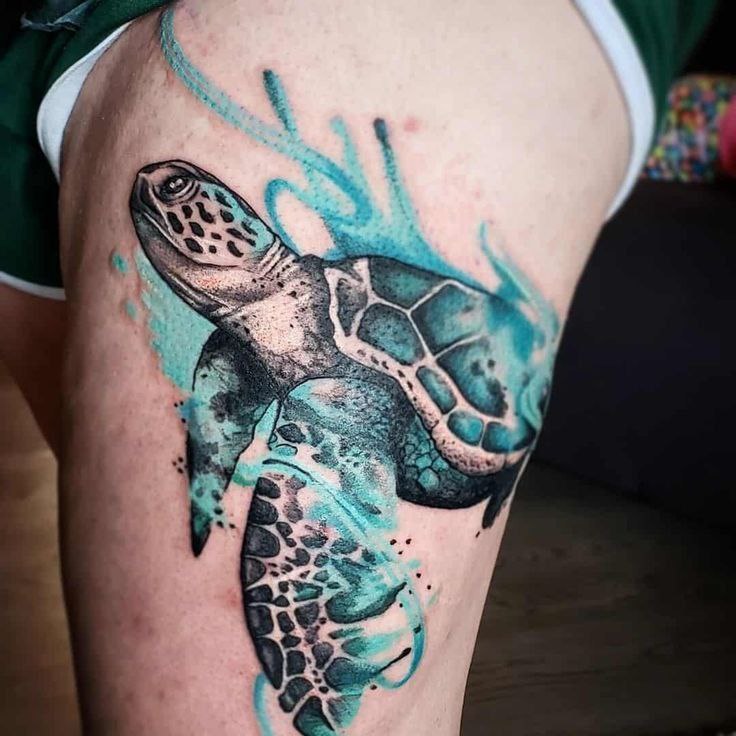 Tattoo of a colored turtle on the thigh for women