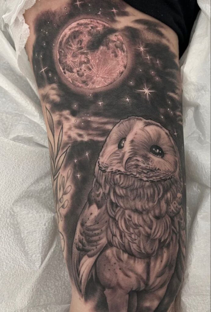 Large owl and starry sky tattoo on the shoulder for men