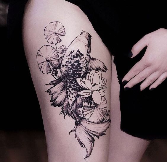 Large carp tattoo on the thigh for women