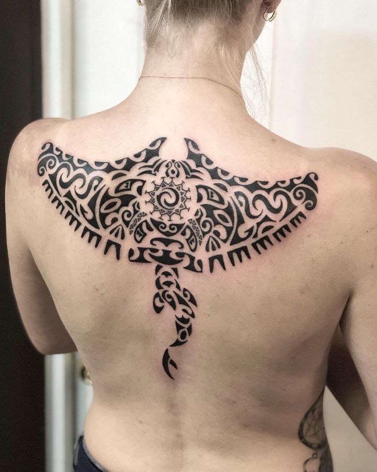 Large stingray tattoo on the back for women