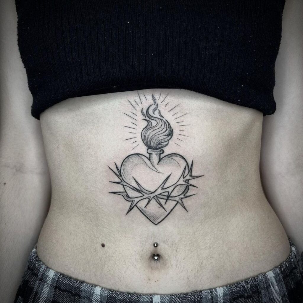 Heart tattoo on the stomach for women