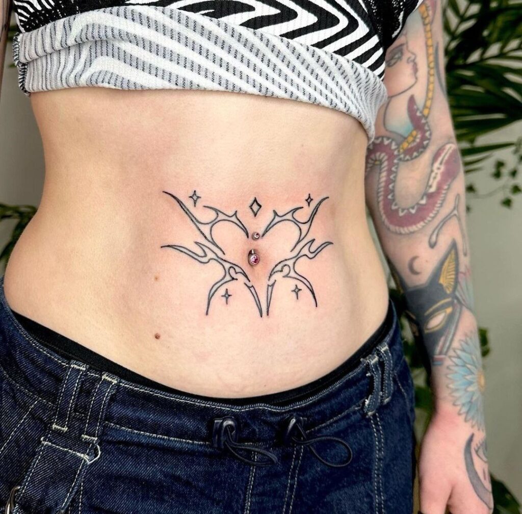 Heart tattoo on the stomach for women