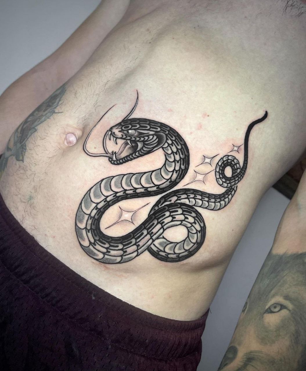 Snake tattoo on the stomach for men